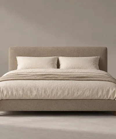Low double bed with an upholstered headboard